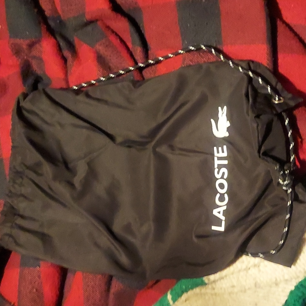 Med size packable lacoste promo draw string bag.